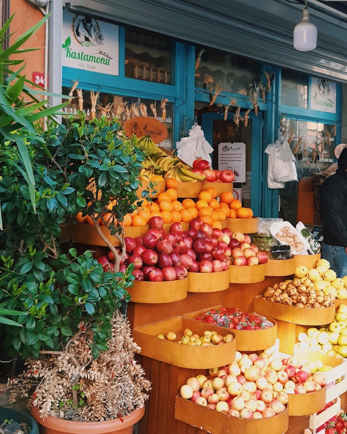Colorful fruits arranged outside a shop at an Istanbul marketplace, showcasing a vibrant selection.